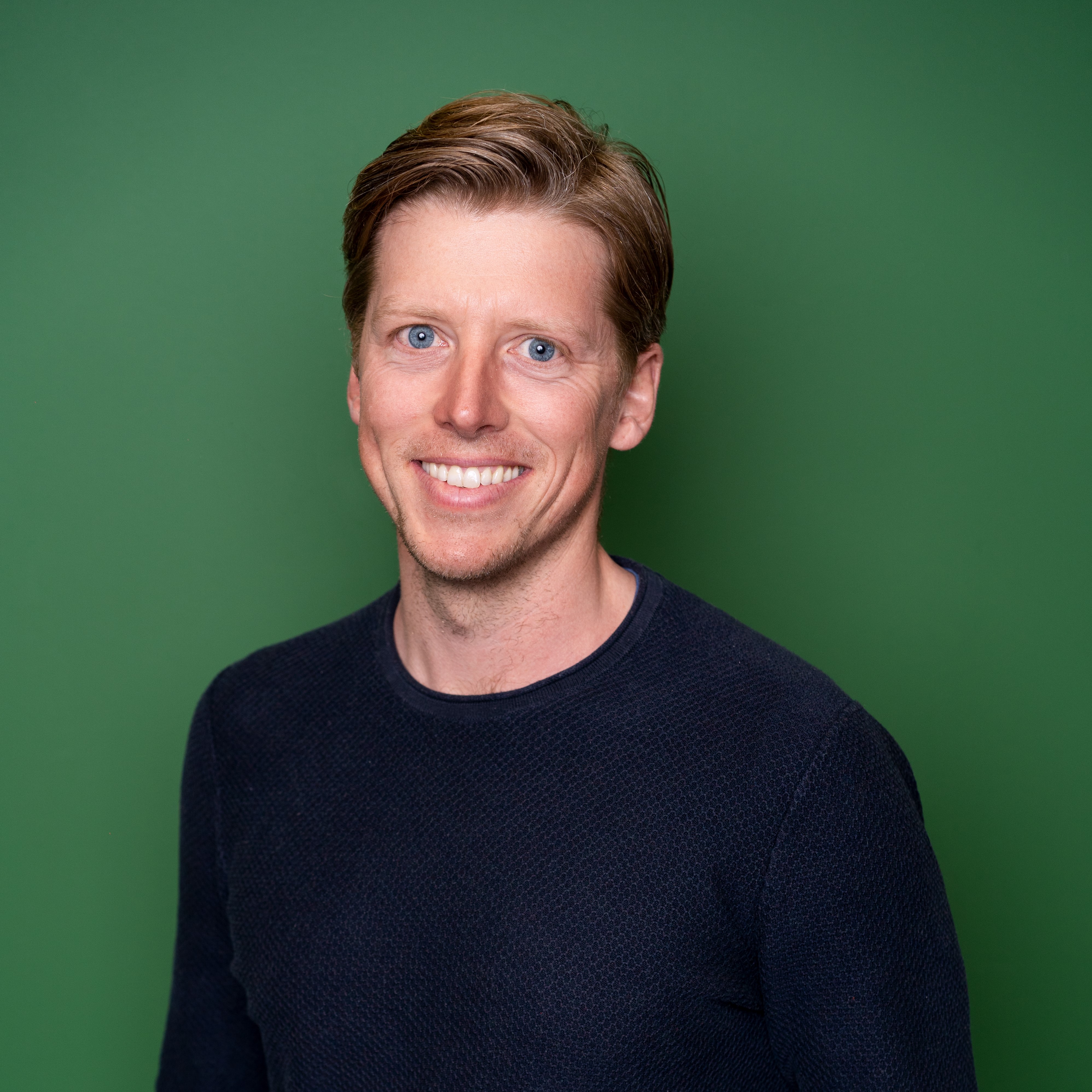 Dr_Manuel_Braun posing for a photo in a black color tshirt